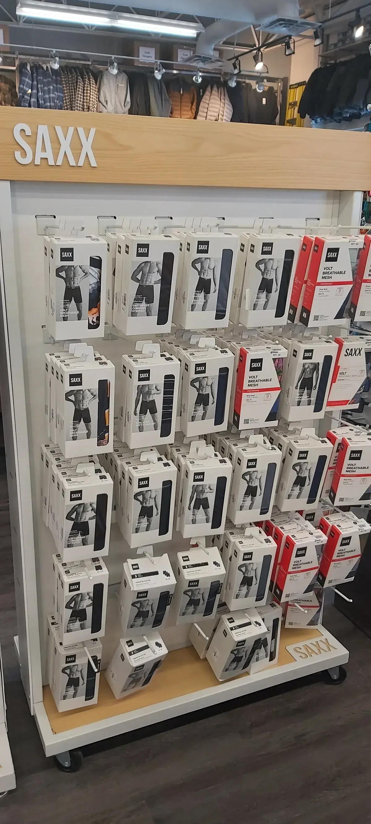 A fully stocked SAXX endcap fixture on the sales floor